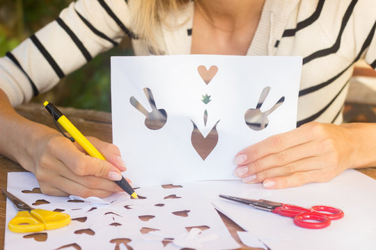 Woman making traditional Danish Easter letters