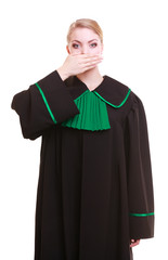 Woman lawyer attorney wearing classic polish gown covering mouth