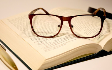 glasses on the book