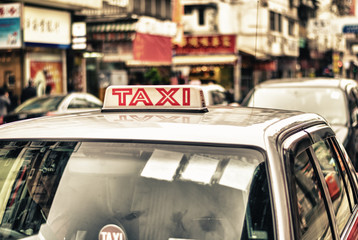 HONG KONG - APRIL 12: Taxis on the street on April 12, 2014 in H - obrazy, fototapety, plakaty