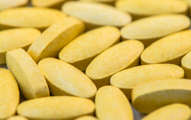 Fototapeta na wymiar Vitamin C tablets macro closeup