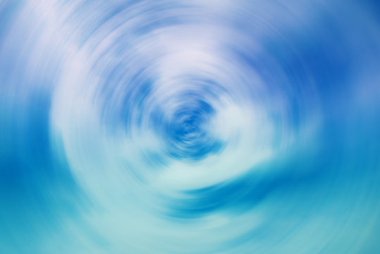 Spin blur of white and blue  background