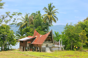 Traditional Batak house on Samosir island, Sumatra, Indonesia © donyanedomam