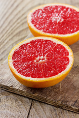 Grapefruit on a rustic wooden board
