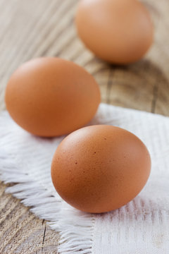 Chicken eggs on old table, rustic style