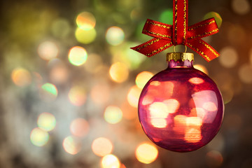 Fototapeta premium Christmas bauble over Beautiful magic bokeh background