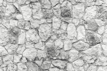Seamless background texture of white stone wall