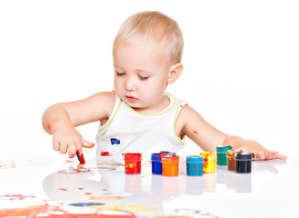 Little baby paint by his hands.