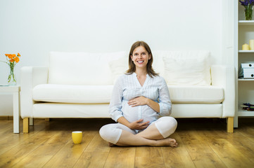 Fototapeta na wymiar Pregnant woman relaxing
