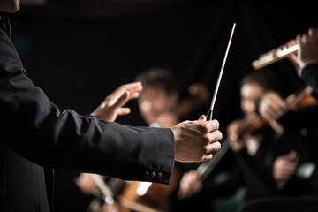 Orchestra conductor on stage - 71759386