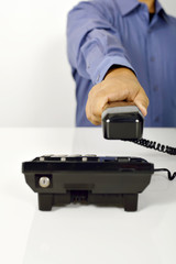 Man Using A Telephone