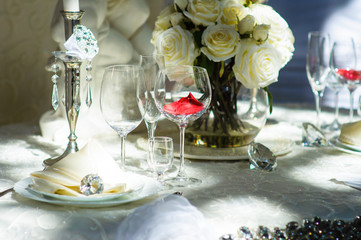 table set service with silverware and glass stemware at restaura