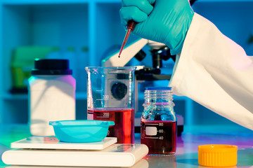 researchers work in modern scientific lab. Preparation of hazard