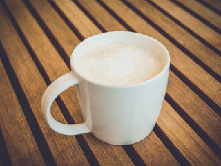 Hot latte with vintage filtered effect