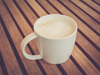 Hot latte with vintage filtered effect