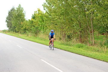 Fototapeta premium male cyclist on a fast race bike