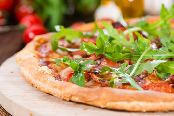 Ham Pizza with rocket and fresh tomatoes