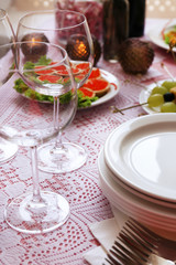 Buffet table with dishware waiting for guests
