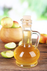 Obraz na płótnie Canvas Apple cider vinegar in glass bottle and ripe fresh apples,