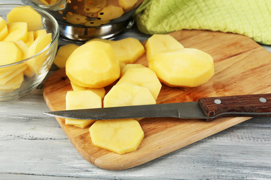 Raw peeled and sliced potatoes