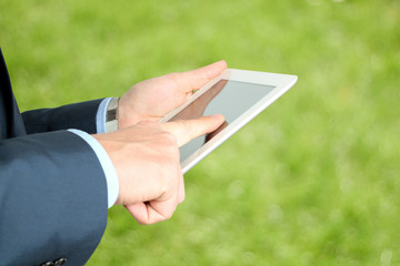business man holding and working with  a digital tablet