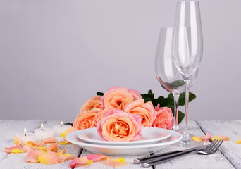 Table setting with pink rose on plate