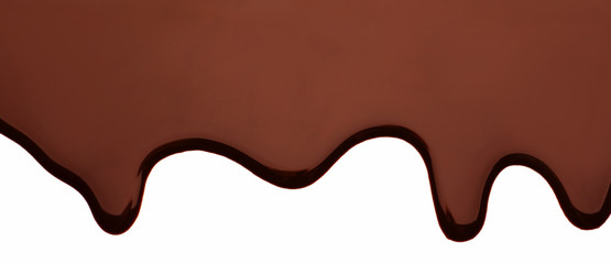 Melted chocolate dripping on white background