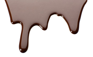 Melted chocolate dripping on white background