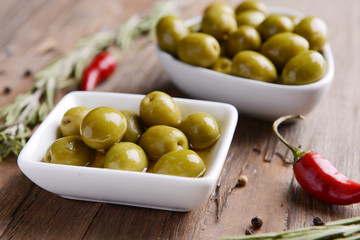 Marinated olives on table close-up