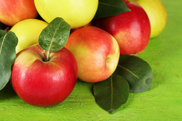 Ripe apples on wooden background