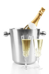 Bottle of champagne in bucket and glasses of champagne,