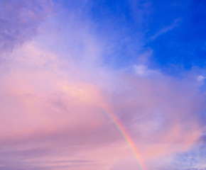 Fototapeta na wymiar Rain and Sunshine Fragment of a Rainbow