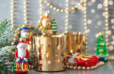 christmas toys with golden lanterns and defocused lights