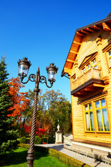 The wooden house and street lamp