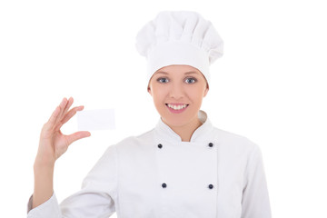young woman chef  in uniform showing visiting card isolated on w