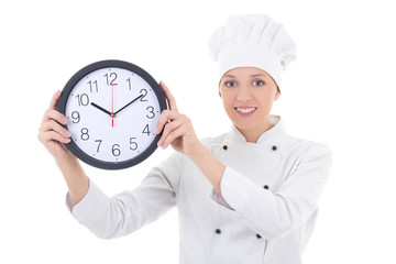 young happy woman chef in uniform holding office clock isolated