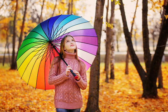 happy girl with umbrella outdoor