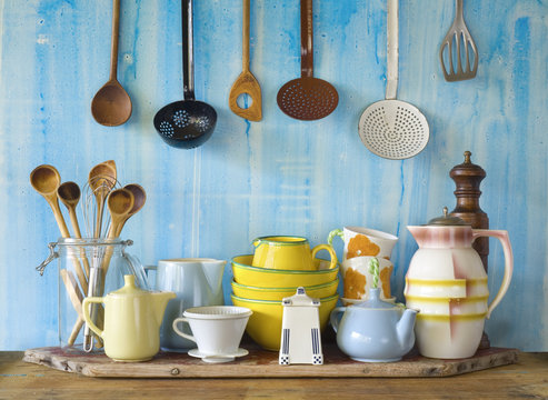 collection of vintage kitchenware, blue background