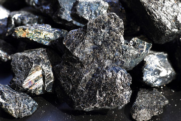 Black tourmaline an aquamarine crystal black background