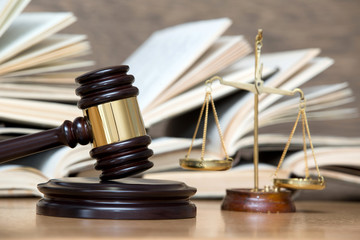 wooden gavel and books