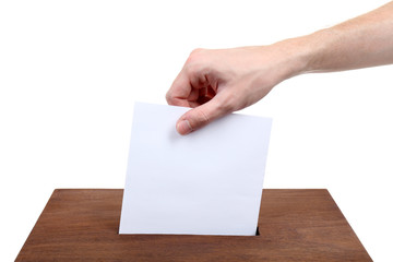 Obraz premium Human hand inserting envelope in mailbox isolated on white