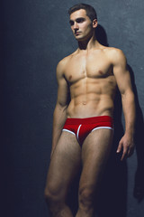 Male beauty concept. Portrait of fashionable and undressed young