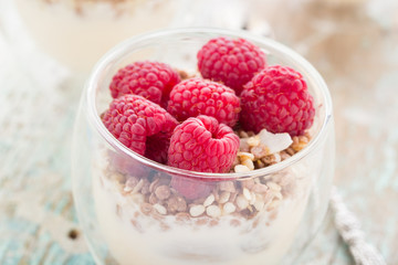 Yogurt with muesli and fresh raspberries