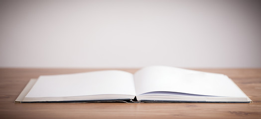 Open book on wooden deck