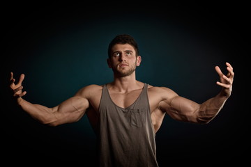 Naklejka premium athletic young man portrait in studio
