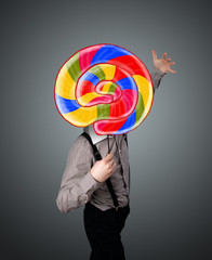 Fototapeta premium Businessman holding a lollipop