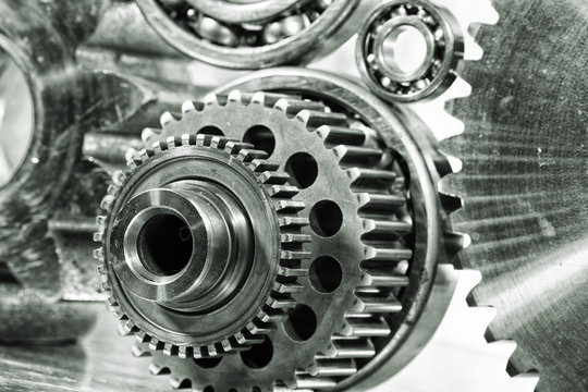 cogwheels, gears and machinery against titanium