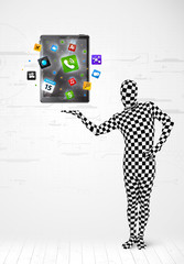 man in full body suit holdig tablet pc