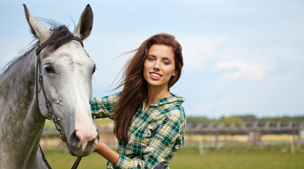 Obraz premium portrait beautiful woman long hair next horse