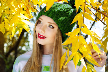 Autumn woman happy with colorful fall leaves